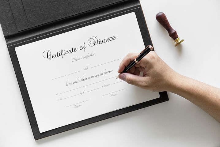 certificate of divorce being signed